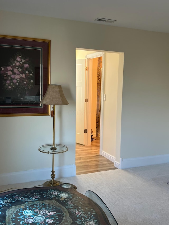 hallway featuring hardwood / wood-style floors