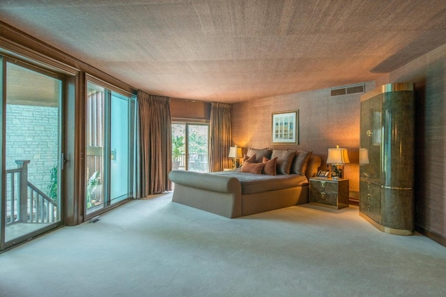 bedroom featuring carpet and access to outside