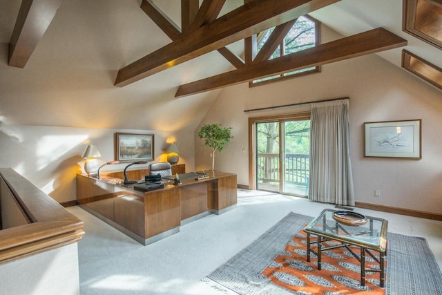 carpeted home office with beam ceiling and high vaulted ceiling