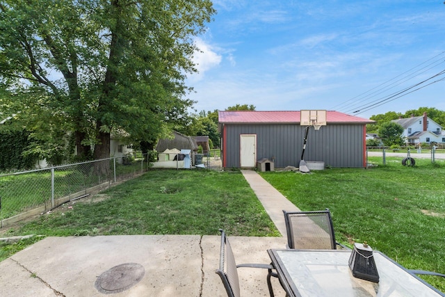 view of yard featuring a patio area and an outbuilding