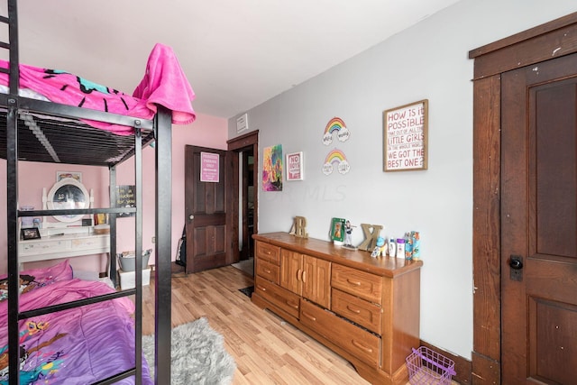 bedroom featuring light hardwood / wood-style floors