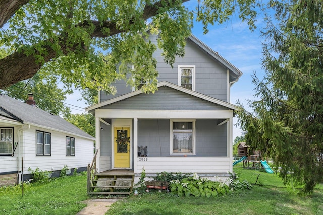 bungalow-style house with a front yard