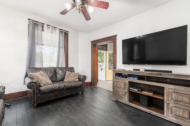 living room featuring dark hardwood / wood-style floors and ceiling fan