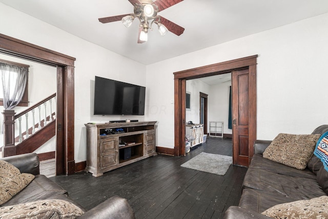 living room with dark hardwood / wood-style floors and ceiling fan