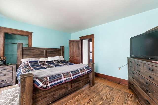 bedroom featuring dark hardwood / wood-style flooring