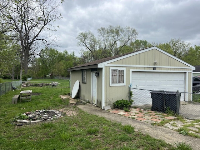 exterior space with a garage and a yard