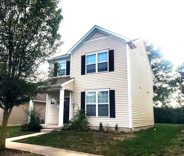 view of front of property with a front lawn