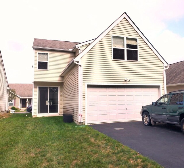 view of front of house featuring a garage and a front yard