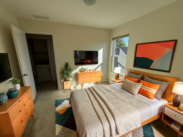 bedroom with light colored carpet