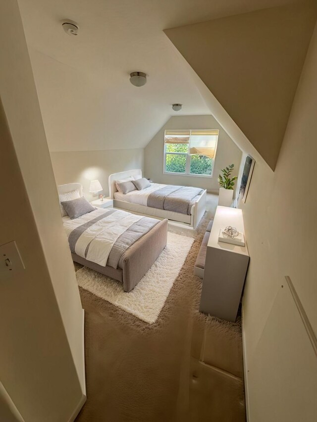 bedroom with lofted ceiling