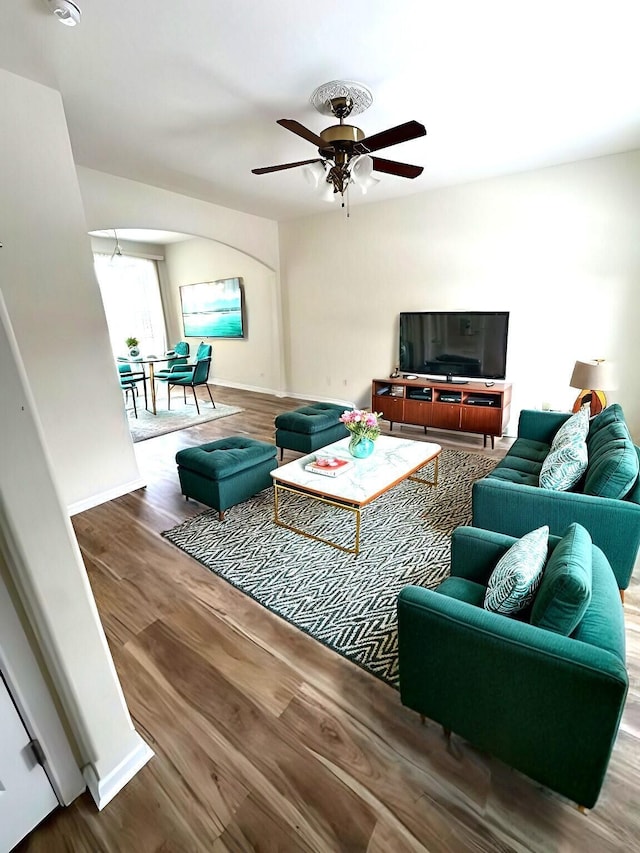 living room with ceiling fan and hardwood / wood-style floors