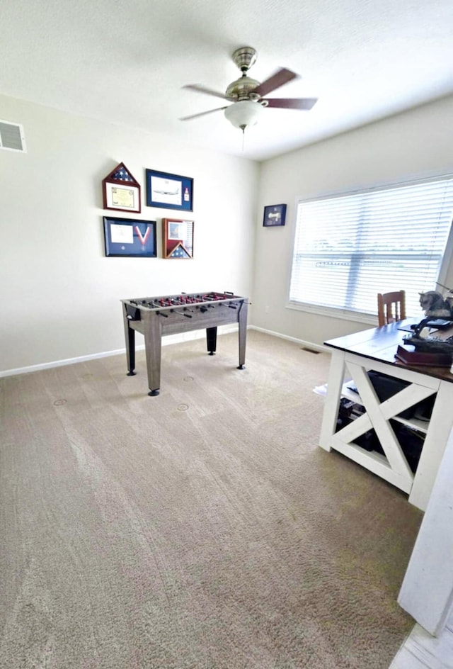 playroom with carpet floors and ceiling fan