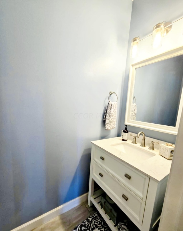 bathroom featuring wood-type flooring and vanity