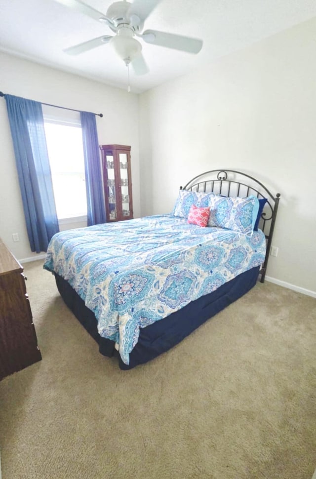 bedroom featuring carpet flooring and ceiling fan