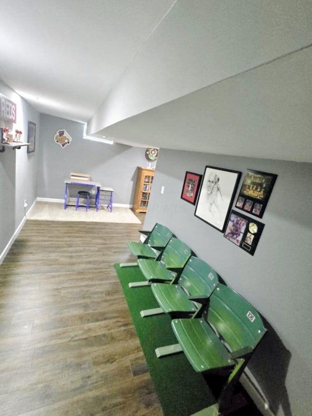 playroom with hardwood / wood-style floors and vaulted ceiling