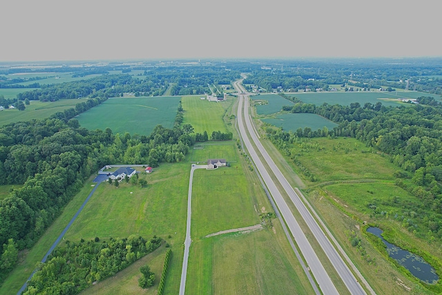 birds eye view of property featuring a rural view