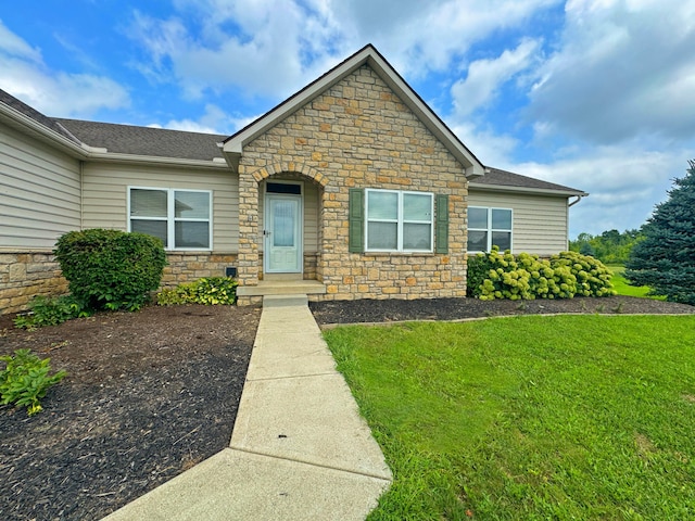 view of front of property with a front lawn