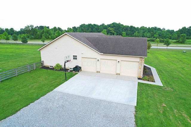 exterior space with a yard and a garage