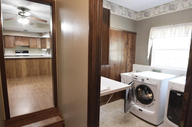 laundry area with separate washer and dryer and ceiling fan