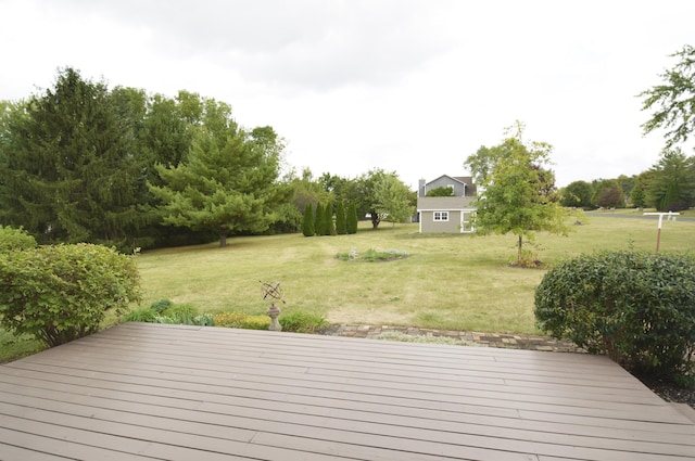 deck featuring a lawn