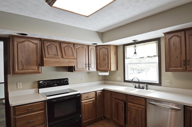 kitchen with dishwasher, hanging light fixtures, a textured ceiling, sink, and black / electric stove