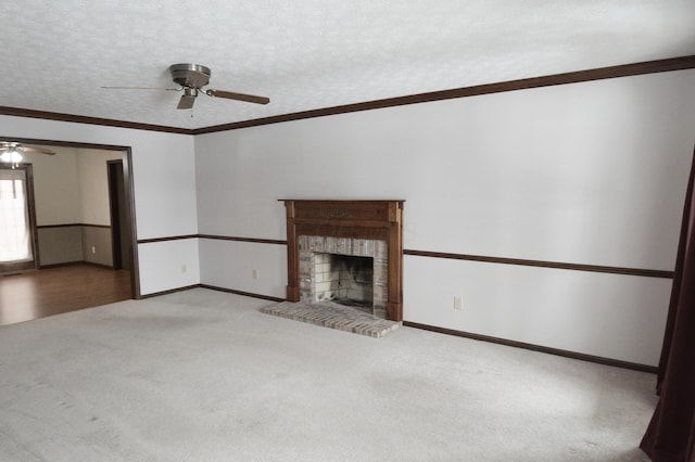 unfurnished living room with a textured ceiling, ceiling fan, a brick fireplace, and light carpet