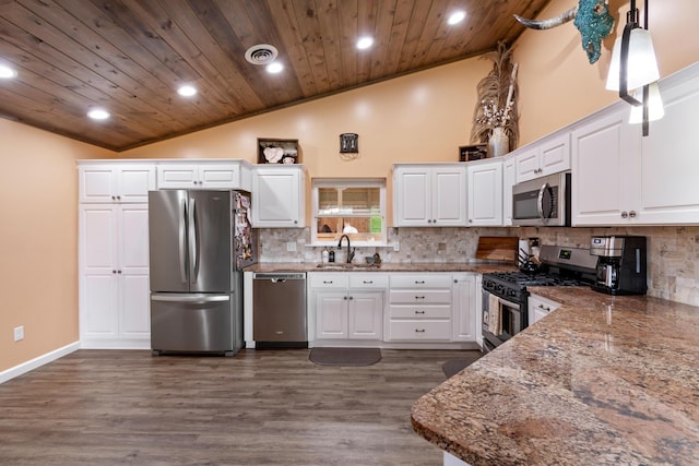 kitchen with wooden ceiling, a sink, visible vents, appliances with stainless steel finishes, and tasteful backsplash