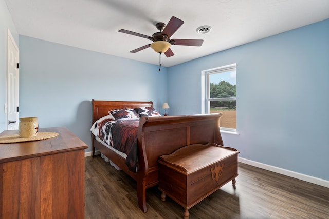 bedroom featuring baseboards, visible vents, ceiling fan, and dark wood-type flooring