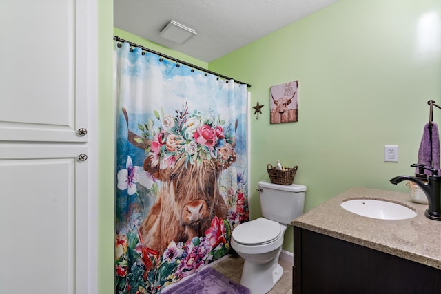 full bath with toilet, a shower with curtain, vanity, and tile patterned floors