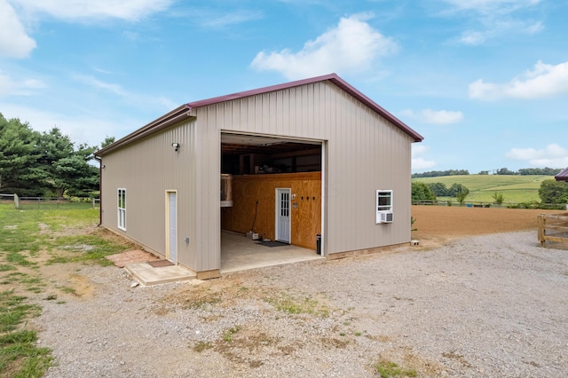 view of pole building featuring a rural view and cooling unit