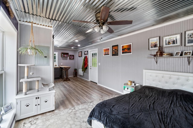 bedroom with light wood-style flooring and baseboards