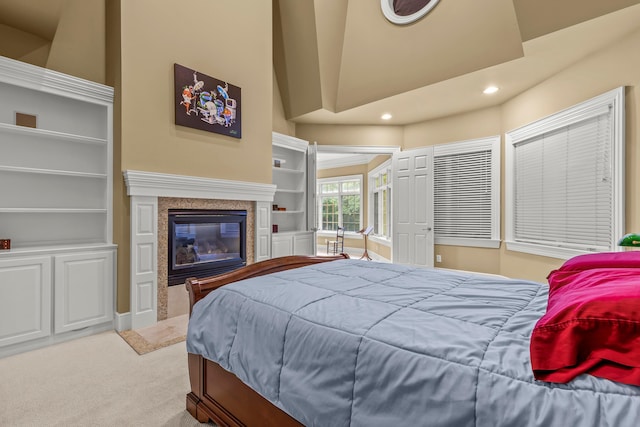 bedroom featuring carpet flooring and a high ceiling