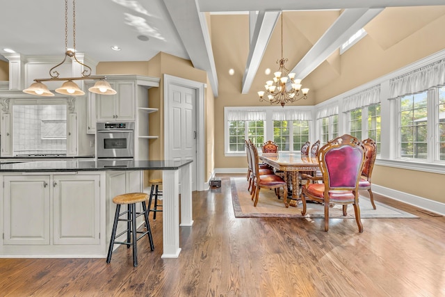 dining space with wood-type flooring, vaulted ceiling with beams, and an inviting chandelier