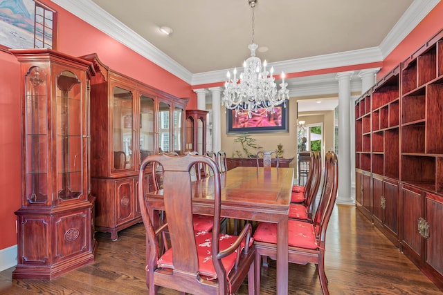 dining room with a chandelier, ornamental molding, dark wood-type flooring, and decorative columns