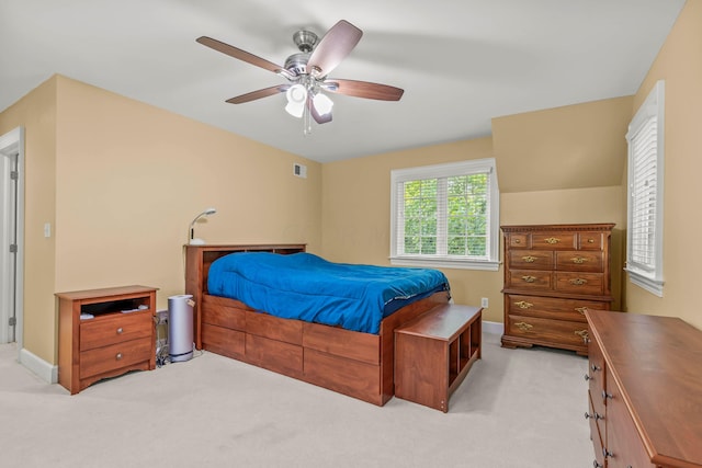 bedroom with light colored carpet and ceiling fan