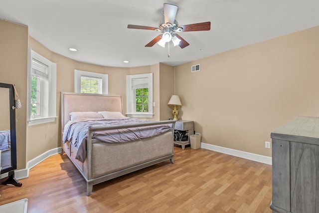 bedroom featuring ceiling fan and light hardwood / wood-style flooring