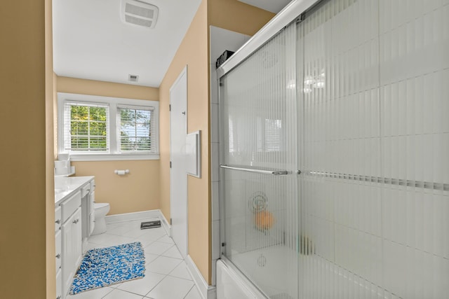 full bathroom with tile patterned floors, vanity, toilet, and enclosed tub / shower combo