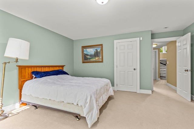 bedroom with light carpet