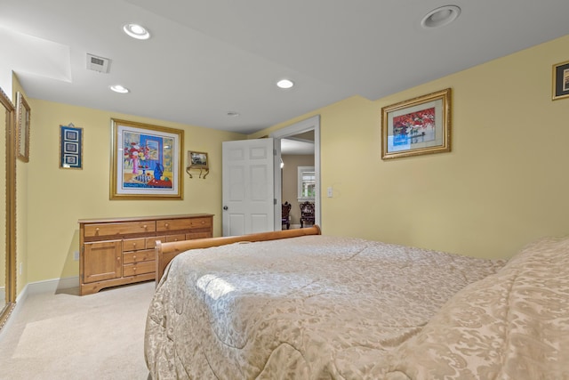 bedroom featuring light colored carpet