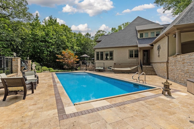 view of pool featuring a patio