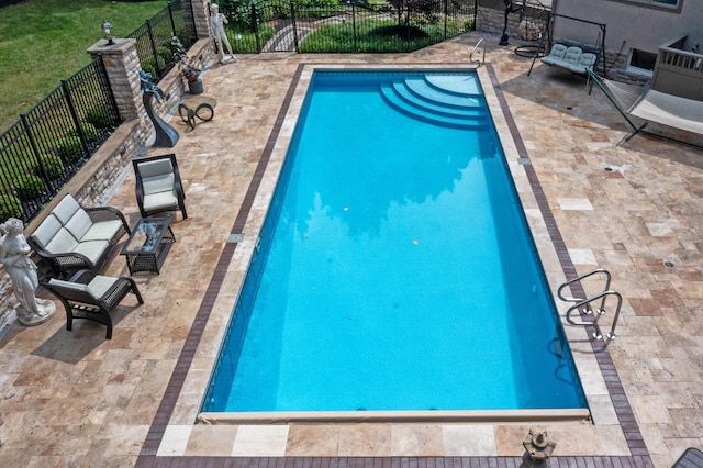 view of pool featuring a patio