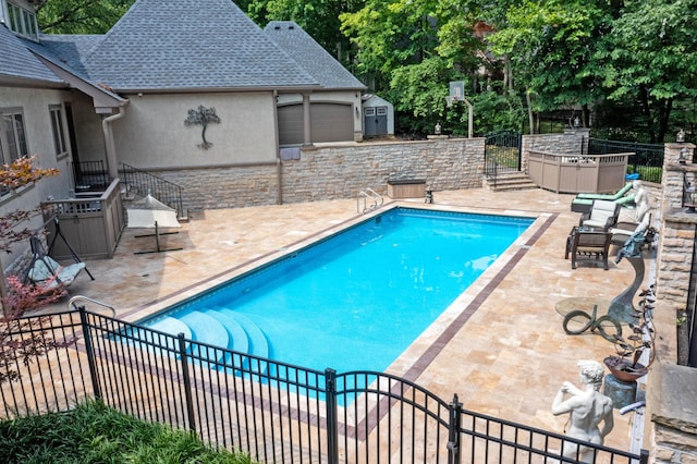 view of swimming pool with a patio