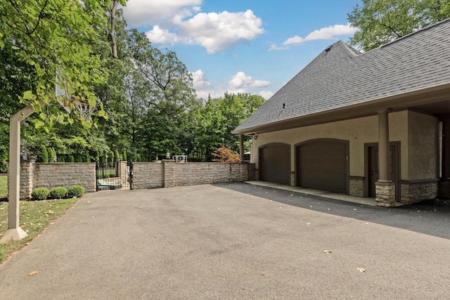 view of side of property with a garage