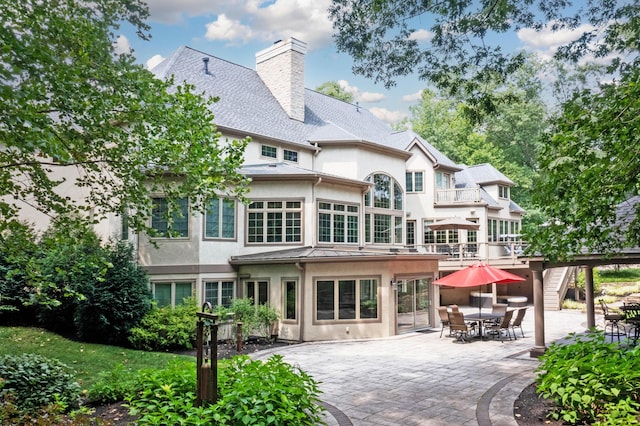 back of house featuring a patio area