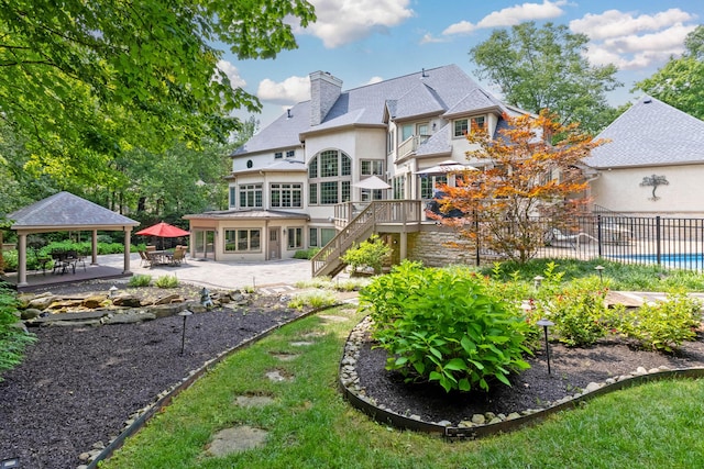 back of property featuring a patio