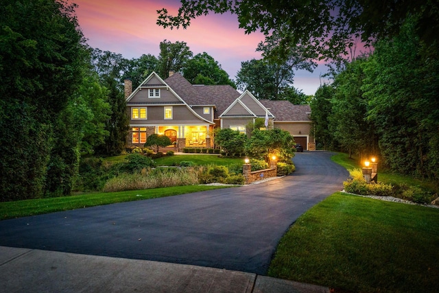 view of front of home featuring a lawn