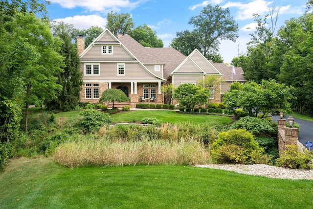 craftsman-style house with a front yard