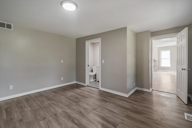 spare room featuring hardwood / wood-style floors