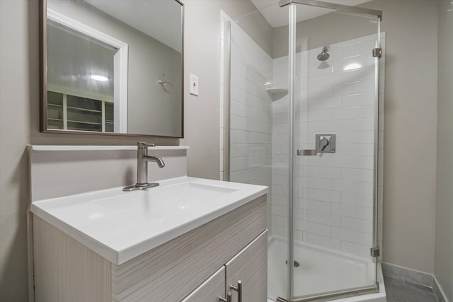 bathroom with vanity and an enclosed shower