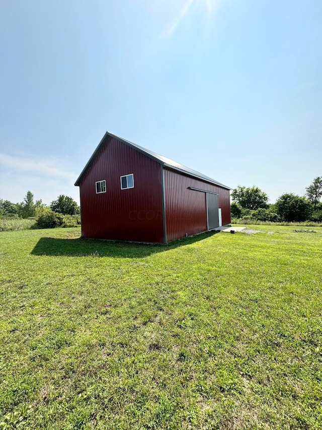 view of outdoor structure with a lawn